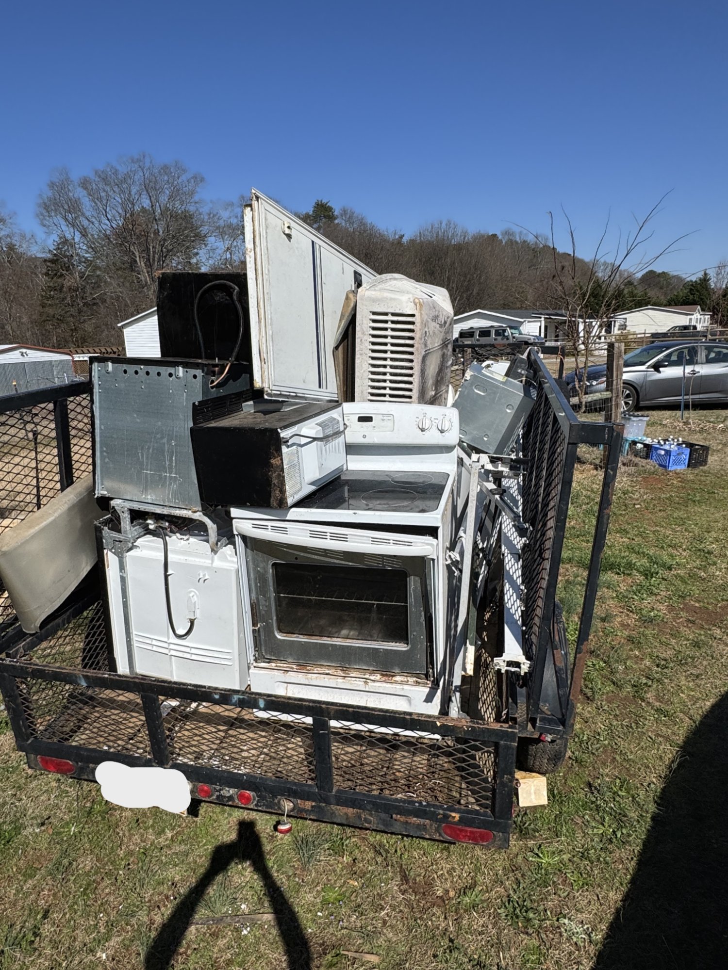 Appliances and scrap metal loaded for haul